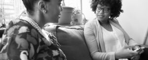 women sitting on a couch