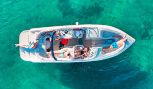 people relaxing on a boat in the water